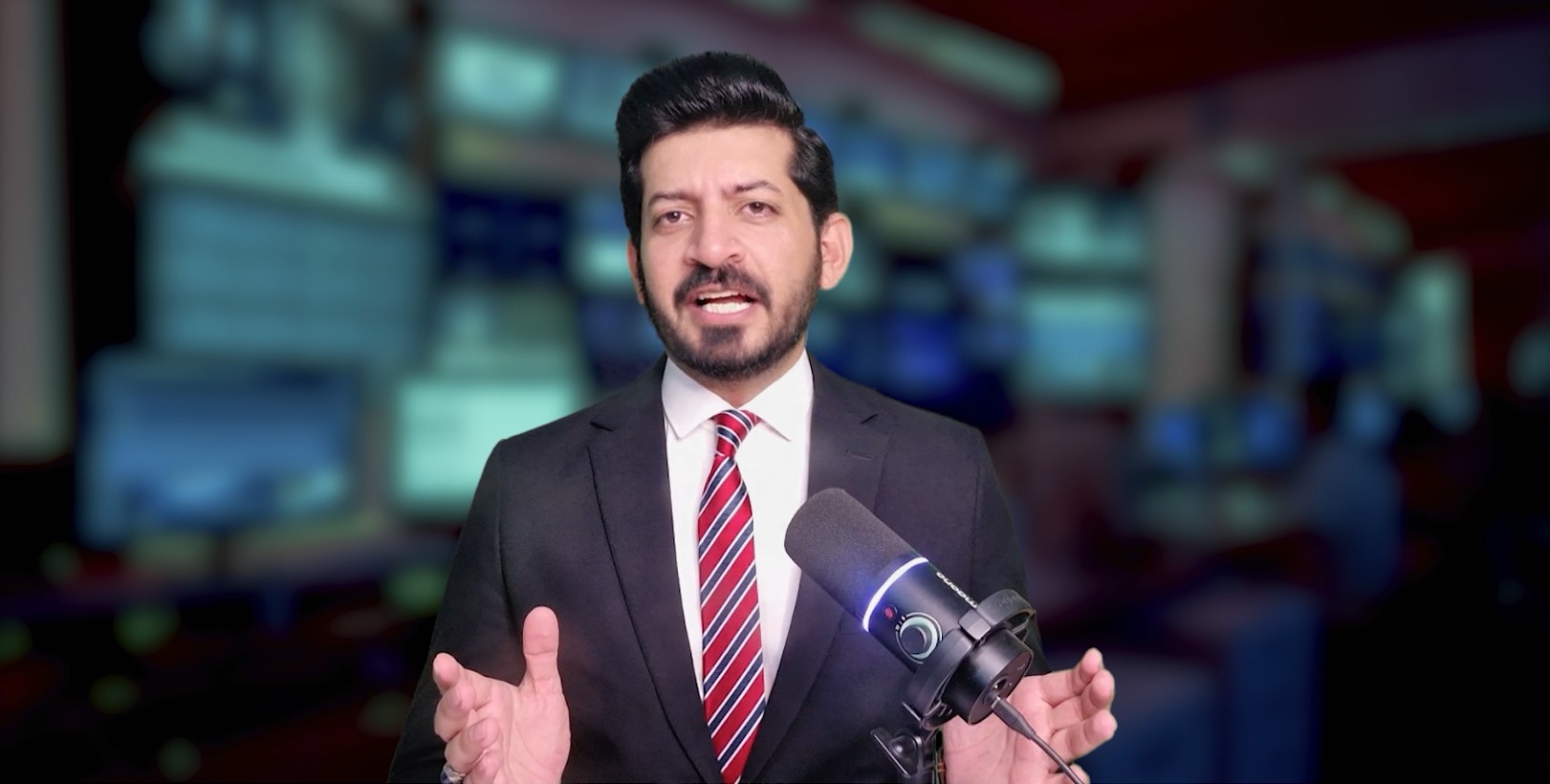 Abdul Mannan hosting a television programme