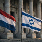 Netherlands and Israeli flags flying outside a government building amid a diplomatic dispute