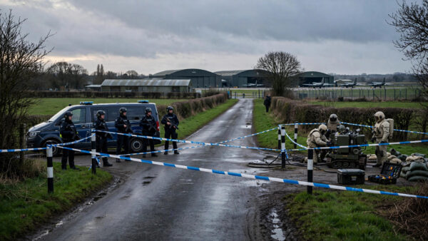 Police cordon and bomb-disposal team outside RAF Fairford airbase