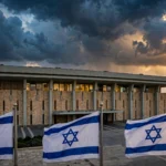 The Knesset, Israel's parliament in Jerusalem, at dusk with Israeli flags flying, ahead of the October 27 general election.