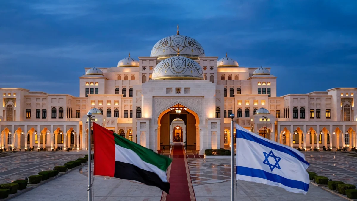 Abu Dhabi's presidential palace at dusk with the flags of the UAE and Israel flying side by side