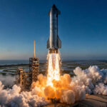 SpaceX Starship rocket launching at dawn from Starbase, Texas.