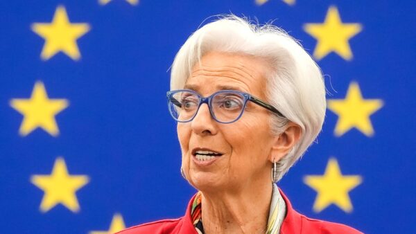 Christine Lagarde speaking at a European Parliament plenary session, before the blue European Union flag with gold stars. File photo, March 2022.