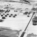 Aerial view of the Ras Tanura oil refinery and tank farm on the Gulf coast, photographed circa 1949.