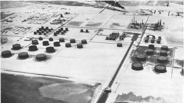 Aerial view of the Ras Tanura oil refinery and tank farm on the Gulf coast, photographed circa 1949.