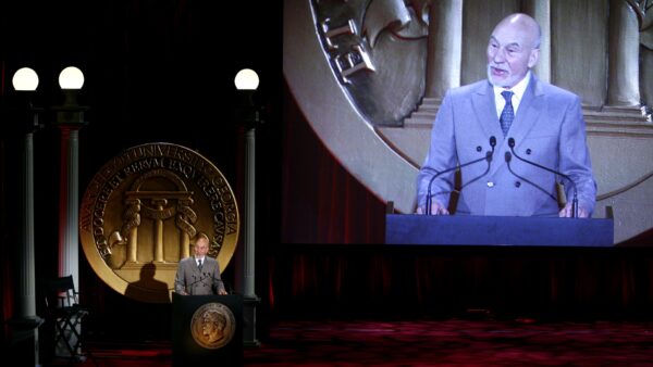 Sir Patrick Stewart speaking at a podium at the 71st Annual Peabody Awards luncheon in New York. File photo, 21 May 2012.