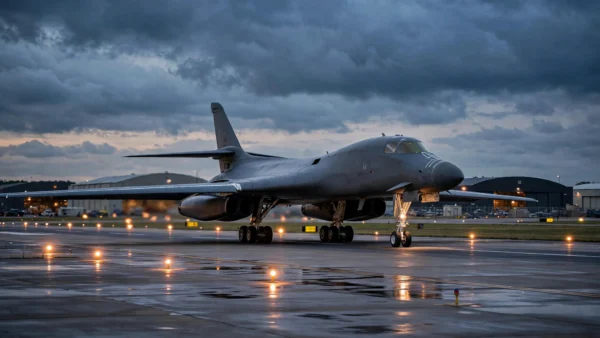 A US B-1 strategic bomber taxiing on a military airbase runway at dusk