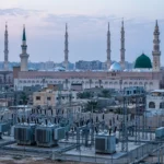 The Prophet's Mosque in Medina at dawn with an electrical substation in the foreground, after the Saudi-led coalition accused the Houthis of a drone attack on a power station serving the mosque.