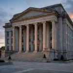 A Tennessee state courthouse with tall stone columns at dusk, representing the Davidson County Chancery Court hearing on preserving evidence from Christa Pike's failed execution.