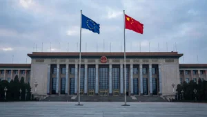 The European Union and Chinese national flags flying side by side in front of Beijing's Great Hall of the People