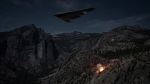 A B-2 stealth bomber flying over mountainous terrain at night during a military strike